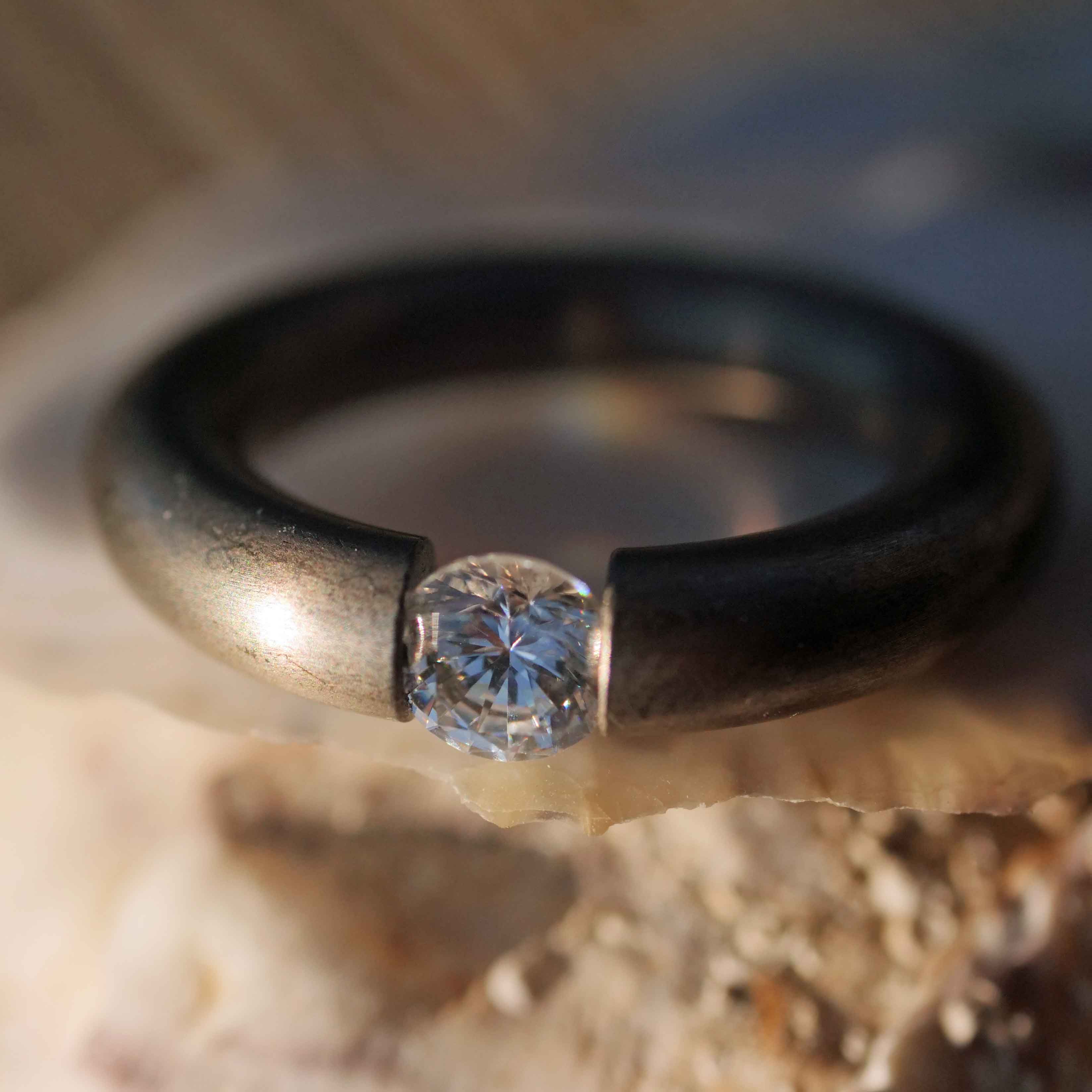 Niessing 0.8 Karäter Zirkonia Rund Spannring 925er Silber grau mattiert neuwertig punziert 